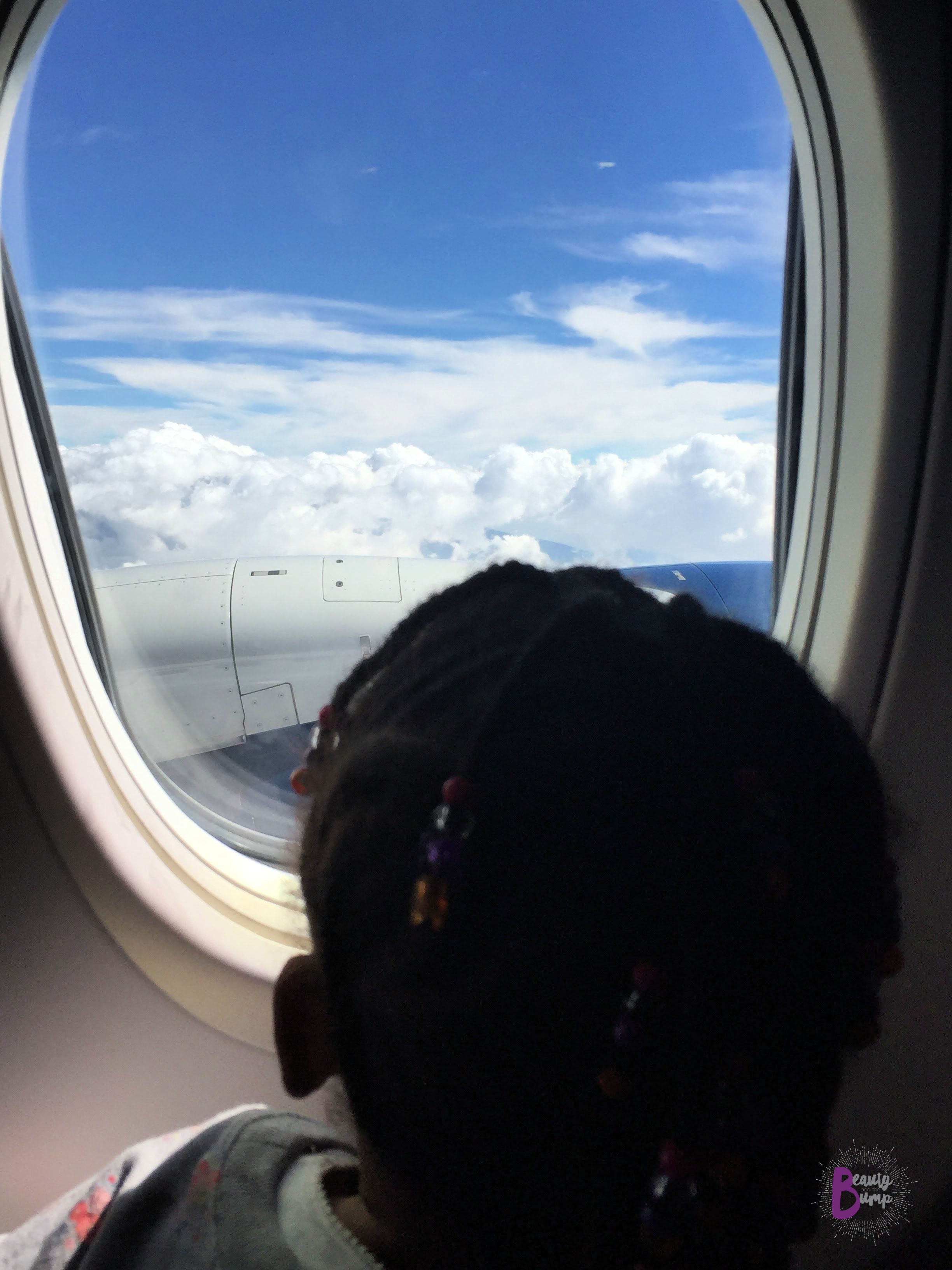 TRaveling with kids Get the kid a window seat so that they are able to see the take-off and landing, as well as the clouds.