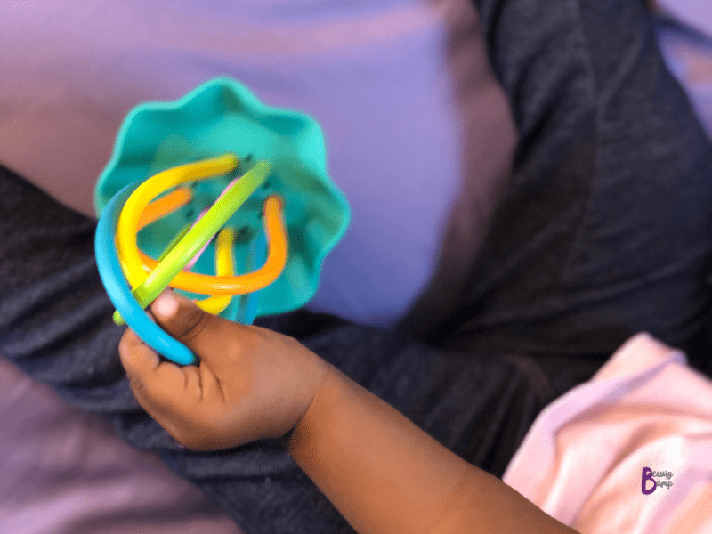 Here we have the Baby Banana Lil’ Squish Jellyfish. It’s one of my toddler’s favorites. It’s not just any old rattle, it functions as a sensory toy and teether toy.