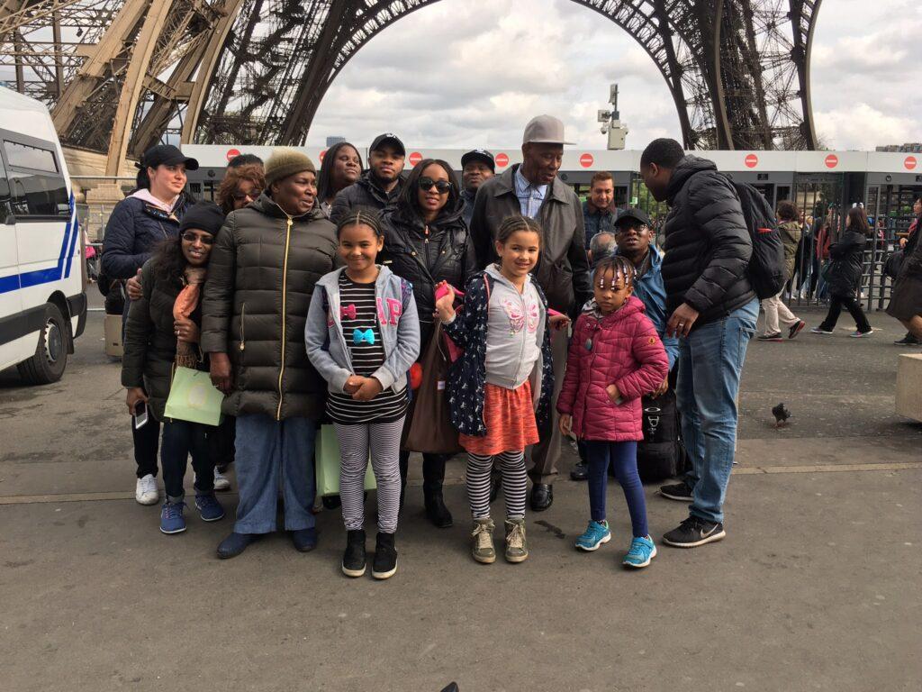 Family photo in front of the Eiffel Tower