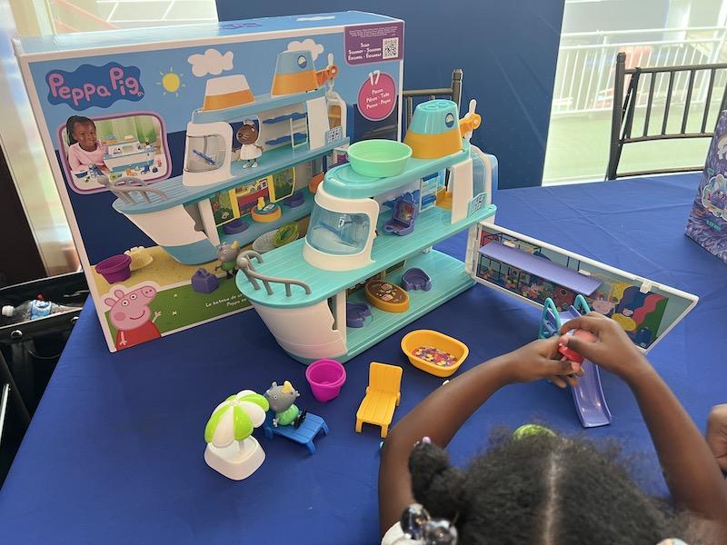 Toddler playing with the Peppa Pig Cruise ship at #SweetSuite23