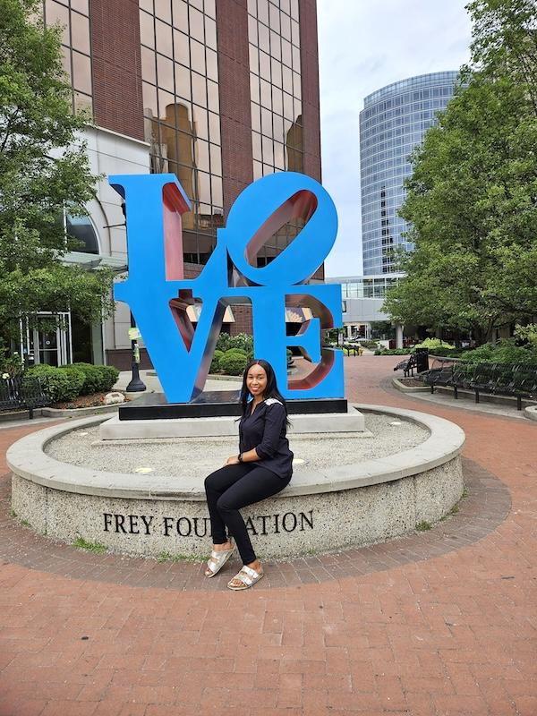 Me posing in front of the LOVE sculpture by American artist Robert Indiana located on Louis Campau Promenade, fronting Monroe Avenue between Louis Street and Pearl Street at 169 Monroe Ave. NW Grand Rapids, MI 49503.